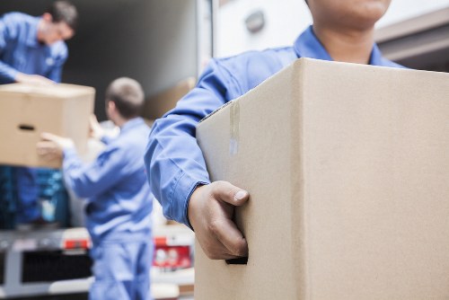Furniture removals team handling a move in Kennington