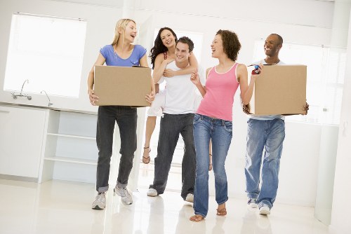 Movers preparing to safely handle packed boxes and equipment