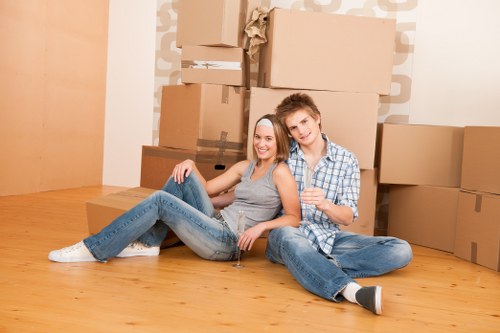 Unpacking boxes into rooms after a move in South London