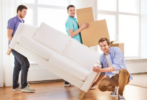 Removal team assessing belongings for a free moving quote