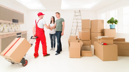Local furniture removal team collecting beds and wardrobes from a Kennington flat