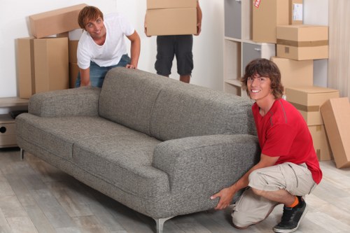 Packed boxes and furniture ready for a Kennington removal van
