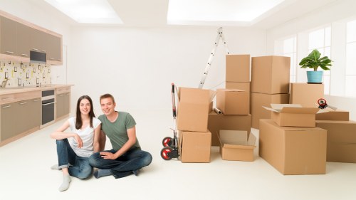 Students moving furniture from a shared flat in Kennington